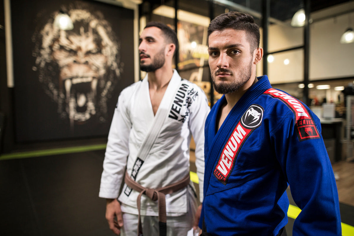 Two BJJ athletes stand together