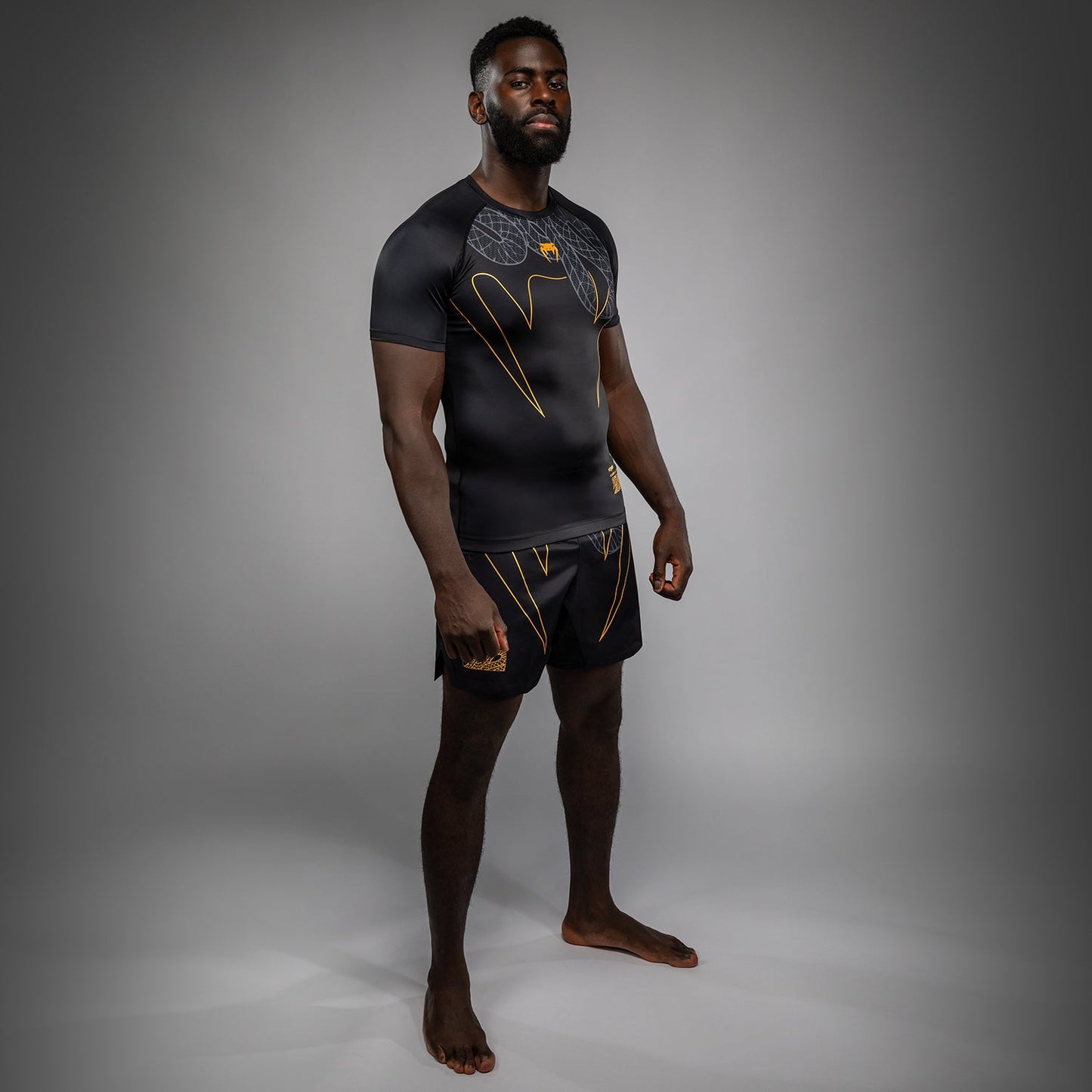 Venum Serpenti Short Sleeve Rashguard - Black/Silver/Gold
