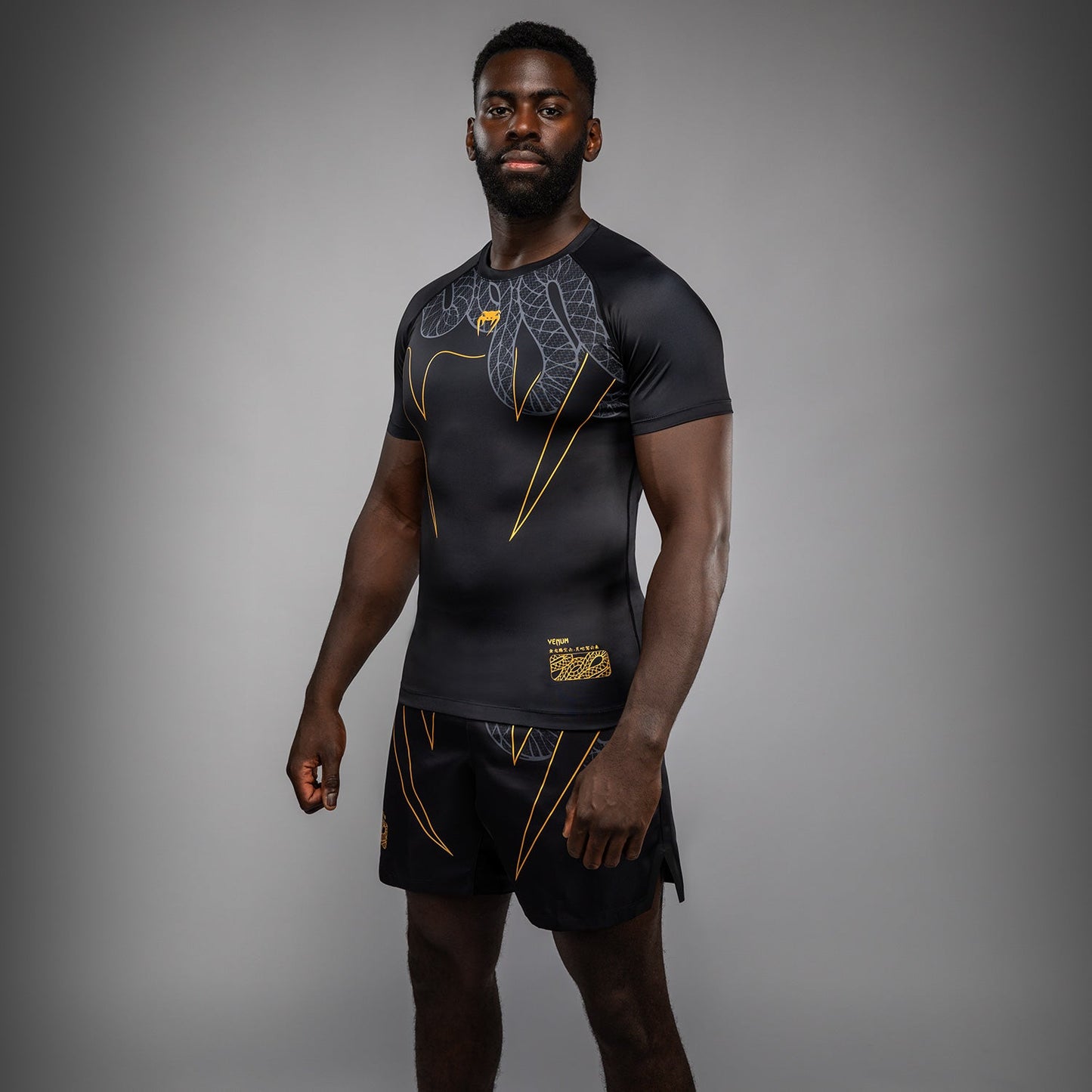 Venum Serpenti Short Sleeve Rashguard - Black/Silver/Gold