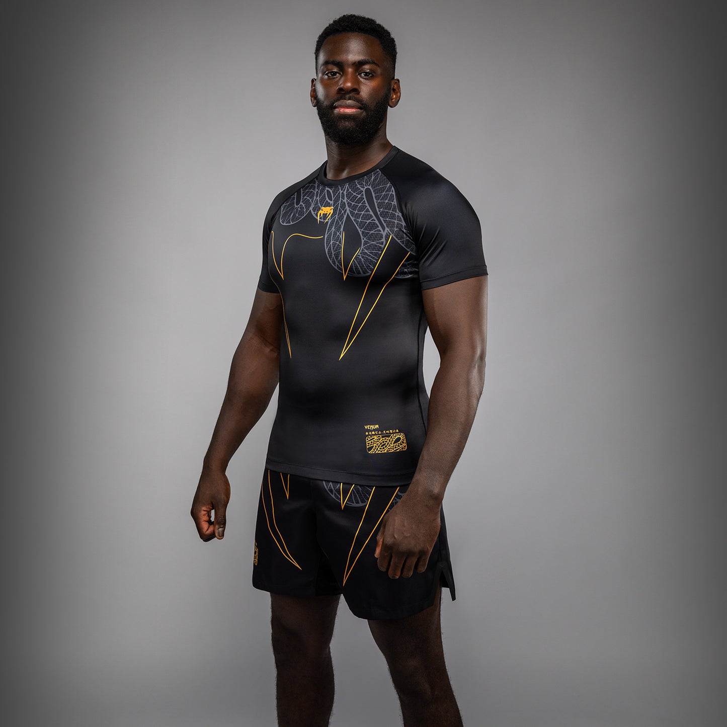 Venum Serpenti Short Sleeve Rashguard - Black/Silver/Gold