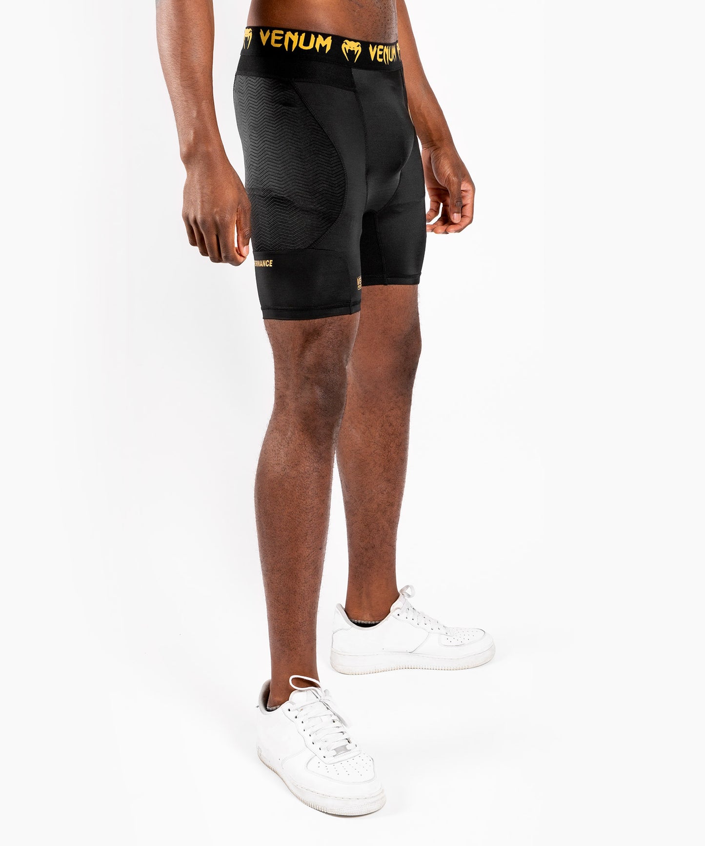 https://www.venum.com/cdn/shop/products/f_252F3_252Ff_252F3_252Ff3f31c67c22ada5bcd95be59cfd28fd557153a1f_SHORTS_COMPRESSION_GFIT_BLACK_GOLD_SD_03.jpg?v=1665747802&width=1445